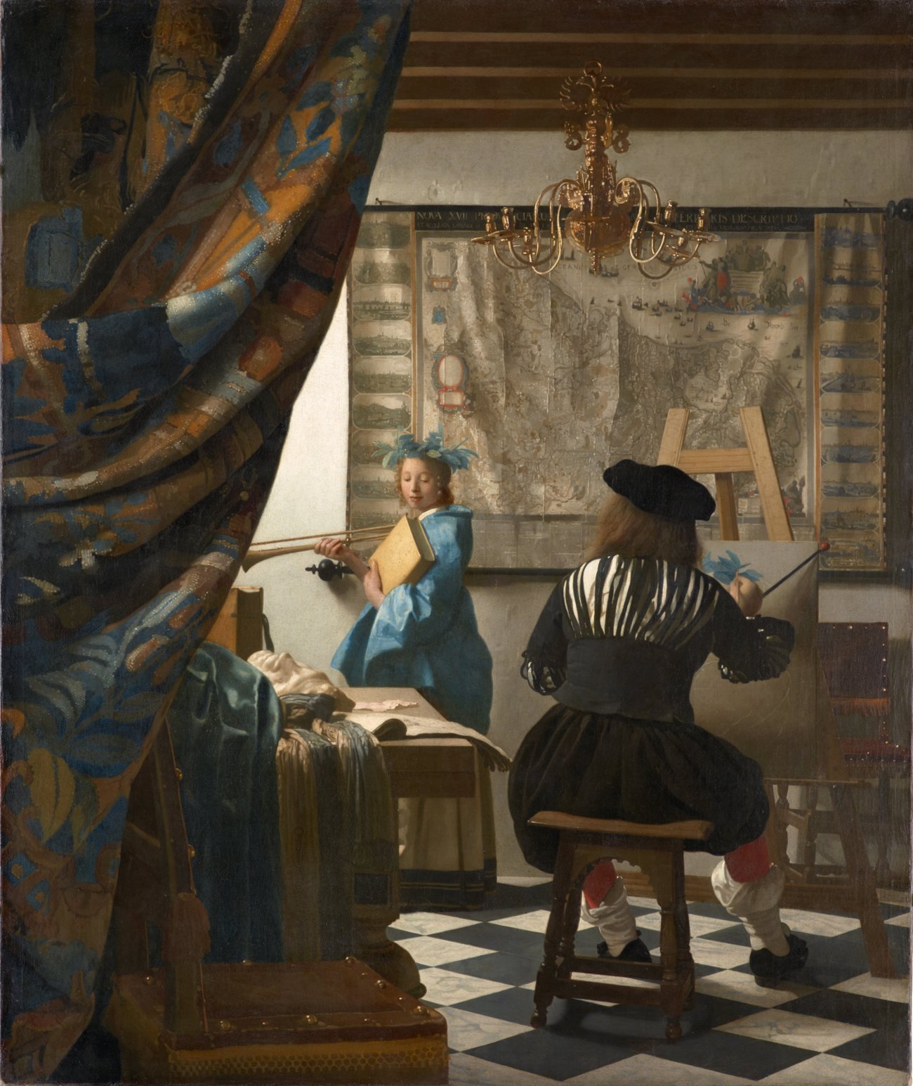 Johannes Vermeer, The Art of Painting: a painter in a black beret, seen from behind, paints a model in blue holding a trumpet and a book, beside a large wall map.